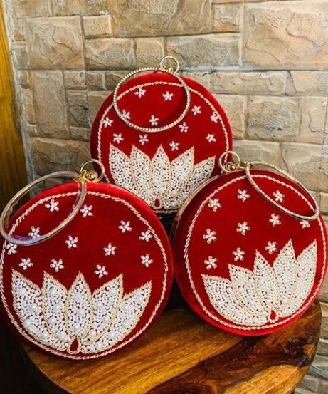 Red round clutch with white lotus beadwork with bangle