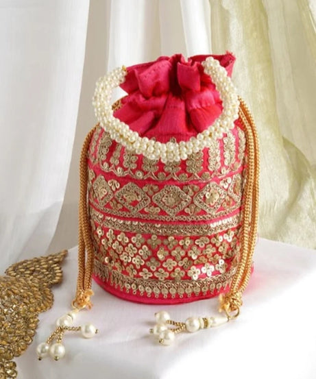 Embellished with Indian hand work potli bag