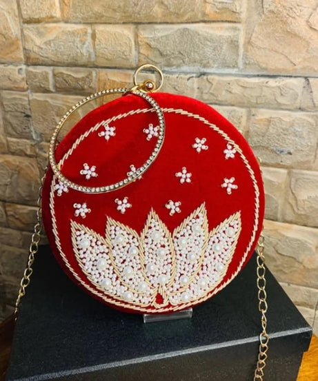 Red round clutch with white lotus beadwork with bangle