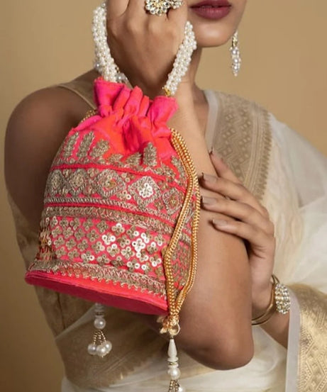 Embellished with Indian hand work potli bag