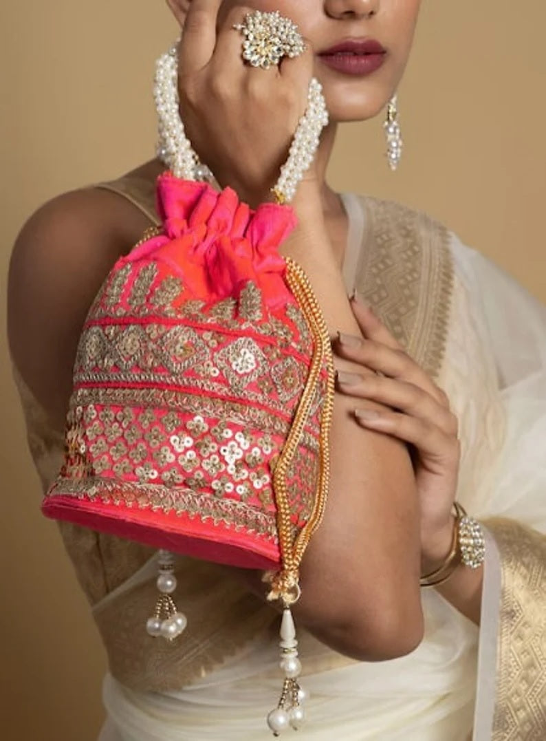 Embellished with Indian hand work potli bag