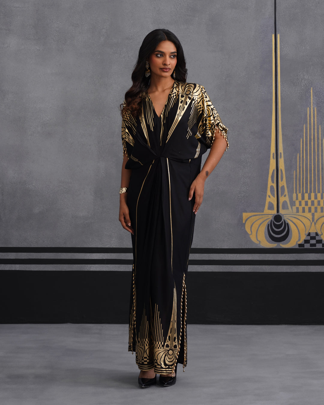 Elegant Black Maxi Dress with Gold Print and Side Slit