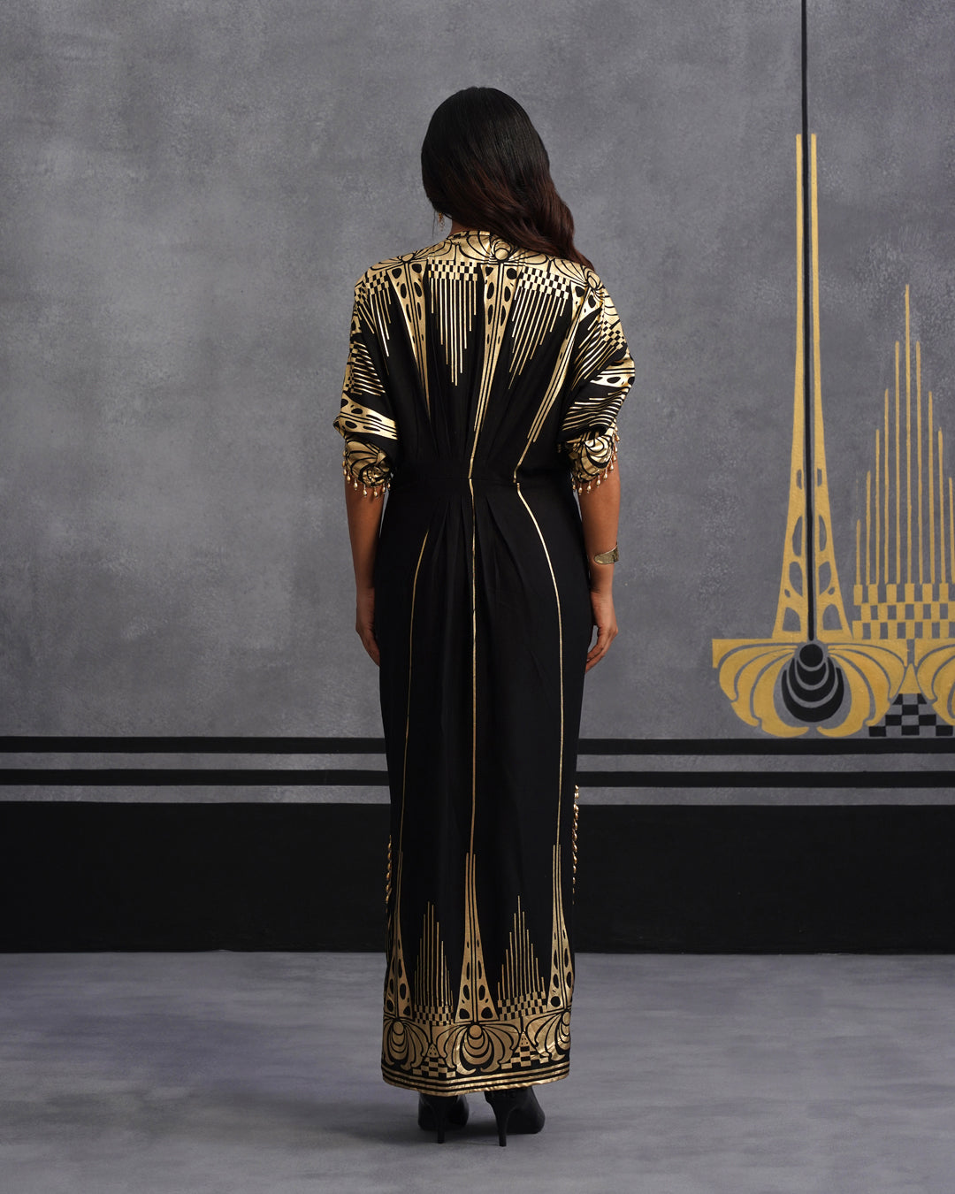 Elegant Black Maxi Dress with Gold Print and Side Slit