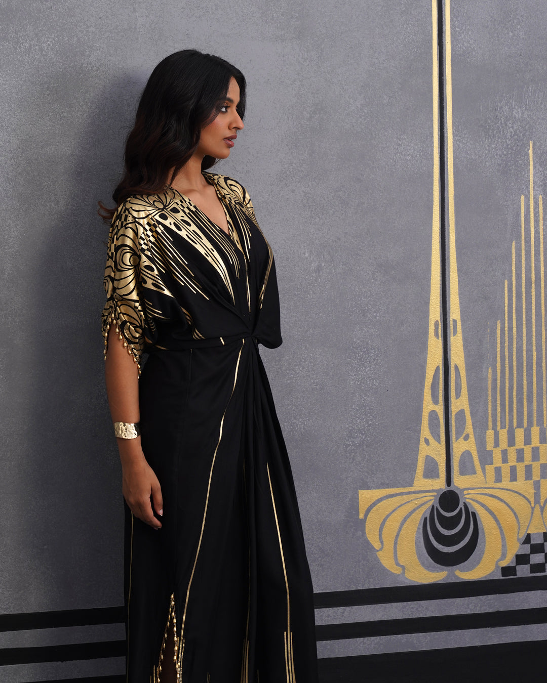 Elegant Black Maxi Dress with Gold Print and Side Slit